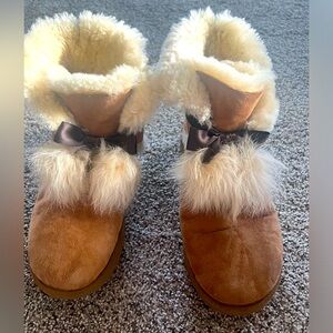 Ugg women booties size 10. Tan color with dangle fur ball tassels